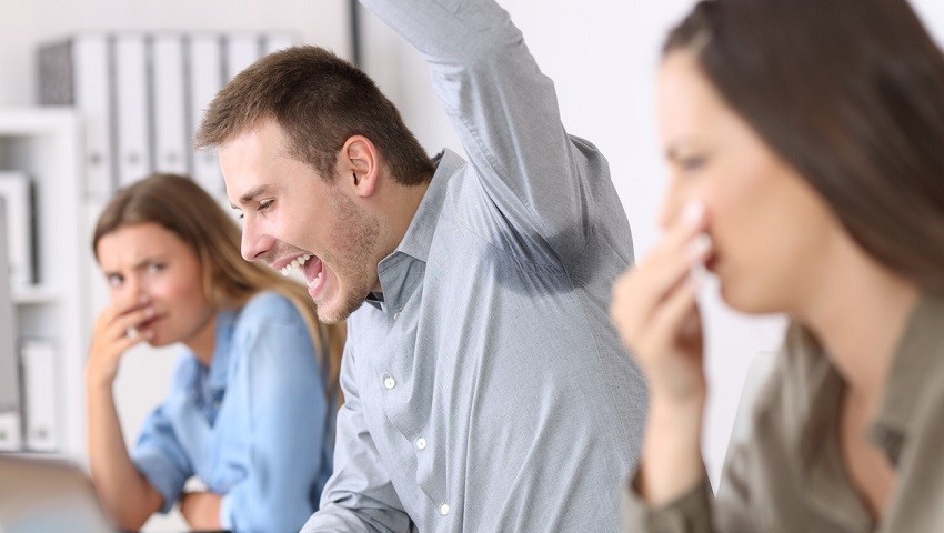 Man Raising His Arm with Wet Armpit