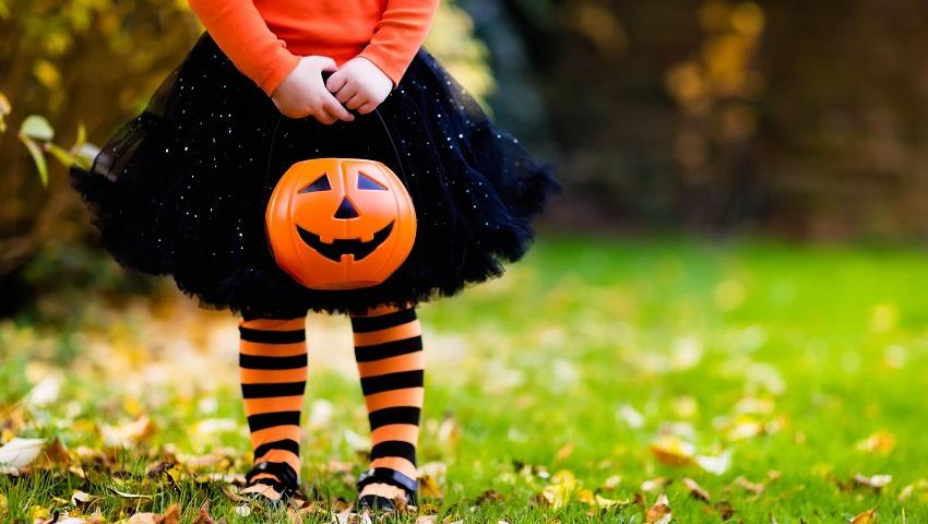 photo-of-child-holding-artificial-pumpkin.jpg