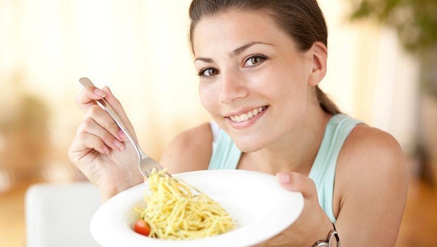 Woman with Plate of Pasta for Weight Loss