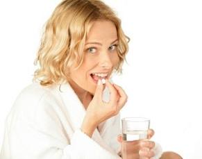 woman-holding-diet-pill-and-bottle.jpg