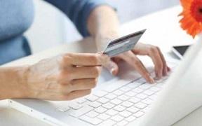 woman-using-laptop-while-holding-credit-card.jpg