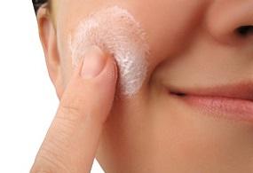 photo-of-a-woman-applying-cream.jpg