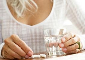 photo-of-a-woman-holding-a-glass-of-water-and-pills845_203.jpg