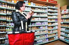 woman-holding-bottle-of-supplement273_223.jpg