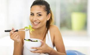 woman-holding-a-bowl-of-vegetable-salad.jpg