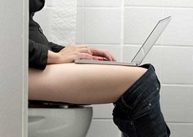 woman-using-laptop-in-the-bathroom.jpg