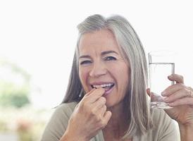 woman-holding-glass-of-water-and-supplement303_394.jpg