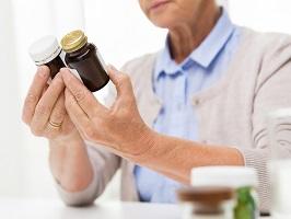 photo-of-woman-holding-bottle-supplements.jpg