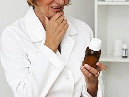 woman-holding-bottle-of-supplements.jpg