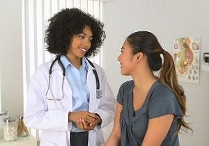 Multi-racial Doctor and Patient Talking