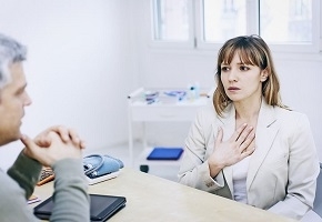Photo of Woman Consulting Doctor