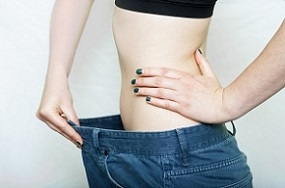 Photo of Woman Holding her Pants