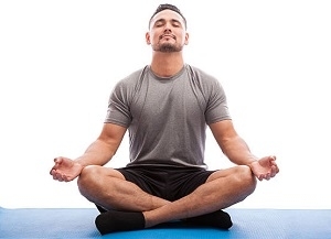 Relaxed man doing some yoga