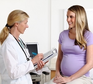 Pregnant Woman Consulting Doctor