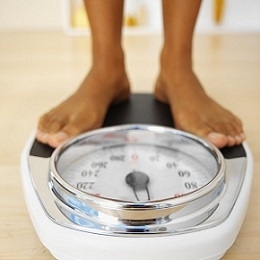 Woman on Weighing Scale