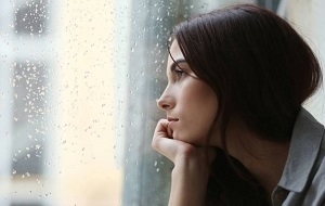 Sad Woman Looking at the Window