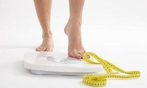 Woman on Weighing Scale