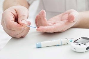 Male Checking His Blood Sugar