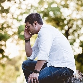 Photo of Tired Man Holding his Head