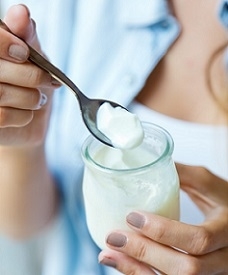 Woman Holding Glass of Yogurt