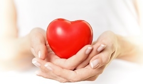 Woman Holding Heart Figure