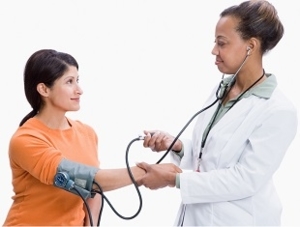 Photo of Doctor Monitoring Patient Blood Pressure