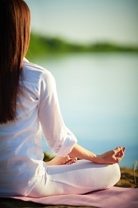 Healthy woman practicing yoga in lotus position