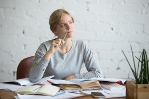 Portrait of a student woman at the desk