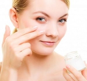 Woman Applying Facial Cream