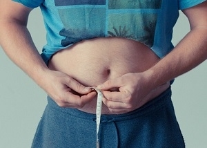 Man Measuring his Waist