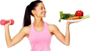 Woman Holding Dumbbell and Plate of Food