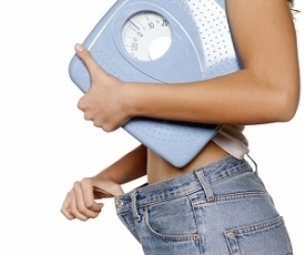 Woman Holding Weighing Scale