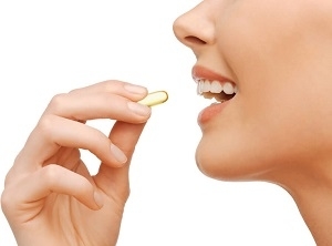 Woman Holding CLA Supplement